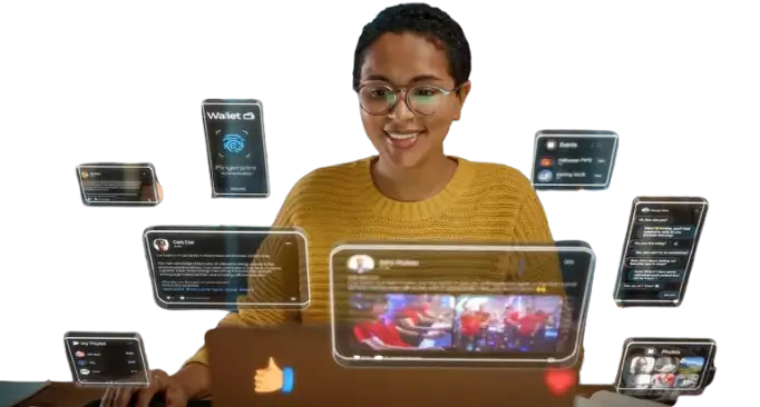 Mulher em frente a telas de computadores trabalhando.